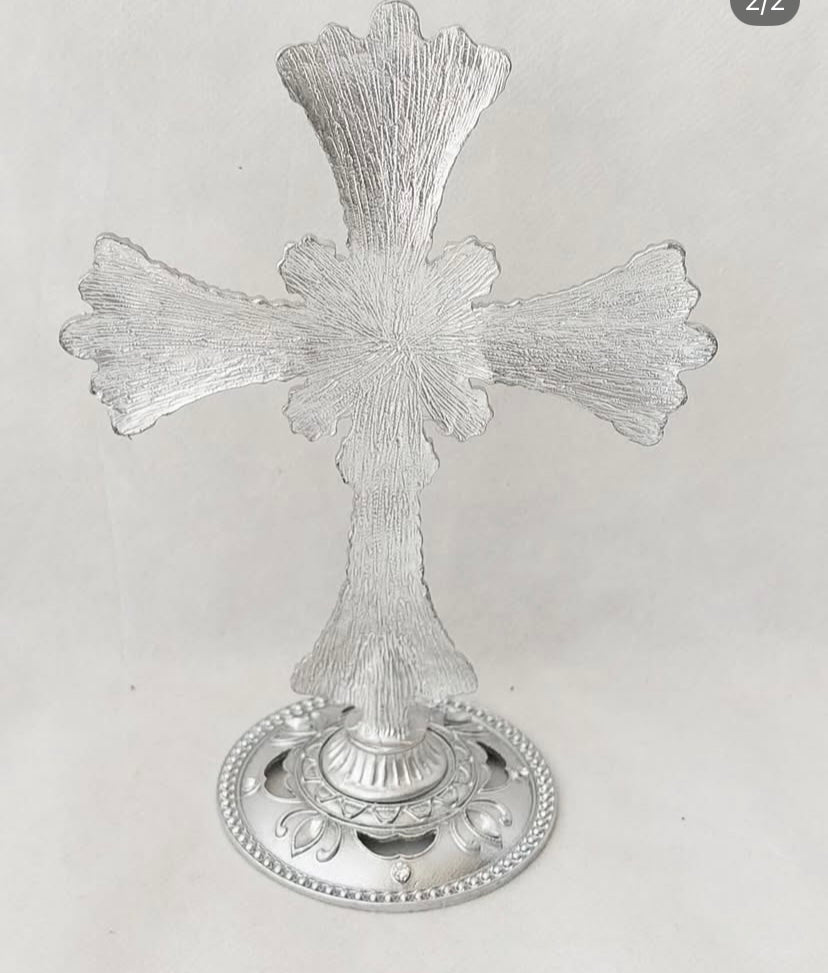 Tall stand  Pearl and stone encrusted cross .